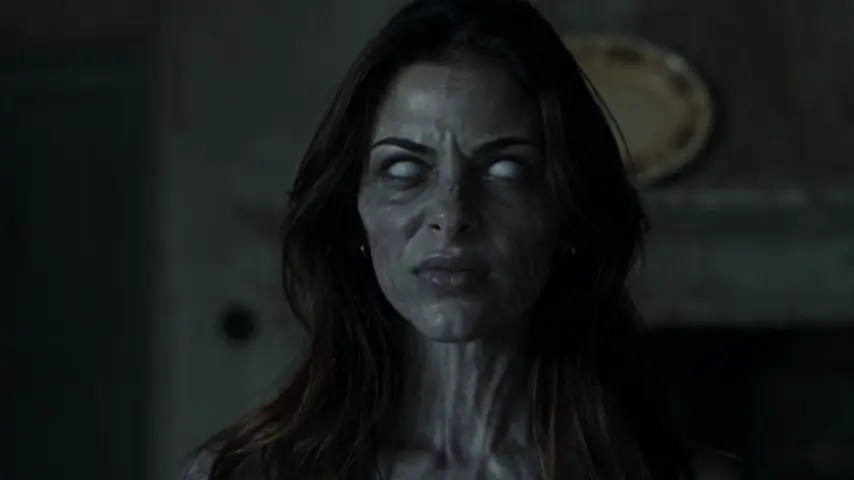 The zombie bares her teeth before the lunge in AI Zombie's original sample